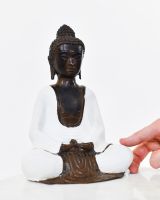 "Stillness Spoken" Cast Brass Buddha Ornament with hand in shot for scale