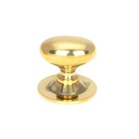 The Aged Brass 33mm Traditional Oval Cabinet Knob Shown Upright on a White Background 