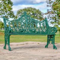 Green Cast Iron Gothic Garden Bench in Use in the garden Green Cast Iron Gothic Garden Bench in Use in the garden