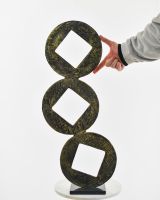 "Triple Aspect" Cast Aluminium Home Ornament - Black and Gold with hand in shot for scale