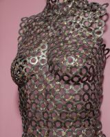 "Vesta" Female Torso Reclaimed Metal Wall Sculpture mounted on wall close up side view "Vesta" Female Torso Reclaimed Metal Wall Sculpture mounted on wall close up side view