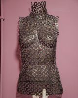 "Vesta" Female Torso Reclaimed Metal Wall Sculpture mounted on wall with hand in shot for scale "Vesta" Female Torso Reclaimed Metal Wall Sculpture mounted on wall with hand in shot for scale