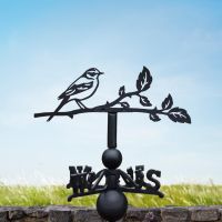 Yellow wagtail weathervane on a summers day