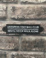 "You"ll Never Walk Alone" Football Club Traditional Cast Iron Wall Sign mounted on brick wall