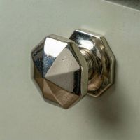 A 39mm Cast Iron Octagonal Cabinet Knob Fitted to a Contemporary Green Kitchen Cupboard Door - Digital Illustration