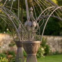 A Close up of a Corner Finial on the Victorian Domed Metal Garden Gazebo with Decorative Pillar Columns - Digital Illustration A Close up of a Corner Finial on the Victorian Domed Metal Garden Gazebo with Decorative Pillar Columns - Digital Illustration