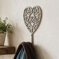 A Close up of a “Heartford” Scroll Heart Design Hook Mounted on a Wall in a Country Home - Digital Illustration 