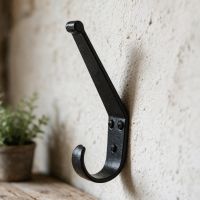 A Close up of the "Belsall Court" Blacksmith Iron Coat Hook Fitted to A Wall in a Traditional Home - Digital Illustration A Close up of the "Belsall Court" Blacksmith Iron Coat Hook Fitted to A Wall in a Traditional Home - Digital Illustration