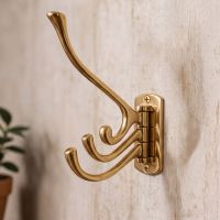 The 3 Prong Brass "Swivel" Hook on a Modern Interior wall - Digital Illustration The 3 Prong Brass "Swivel" Hook on a Modern Interior wall - Digital Illustration
