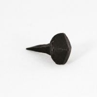 A close up of The Blacksmith door stud Shown on a White Background