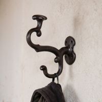 A Close up of the Double Coat and Hat Hook Cast Iron Hook on a Cream Wall. - Digital Illustration A Close up of the Double Coat and Hat Hook Cast Iron Hook on a Cream Wall. - Digital Illustration