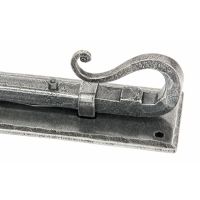 A close up of the Handle of The Shepherds Crook Security Bolt for Windows & Doors 4" in a Pewter Finish on a White Background A close up of the Handle of The Shepherds Crook Security Bolt for Windows & Doors 4" in a Pewter Finish on a White Background