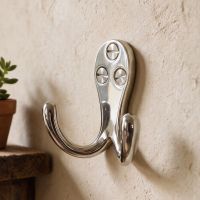 A Close up of the Polished Nickel Double Pronged Coat Hook in a Family Home - Digital Illustration A Close up of the Polished Nickel Double Pronged Coat Hook in a Family Home - Digital Illustration