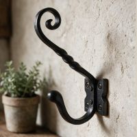 A Close up View of the Black "Lincoln" Coat Hook On a Wall in a Country Home - Digital Illustration A Close up View of the Black "Lincoln" Coat Hook On a Wall in a Country Home - Digital Illustration