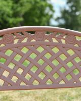 A close up View of the Lattice Backrest of the Antique Pink "Thorpe" Two Seater Garden Bench 