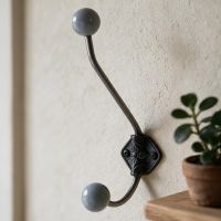 A Deep Grey Ceramic Tip Large Iron Coat Hook in a Corridor Entrance next to a Shelf - Digital Illustration 