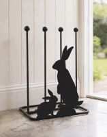 A Mother and Baby Rabbit Steel Boot Rack Placed on a Marble Effect Cottage Porch Entrance - Digital Illustration