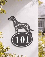 A Number 101 Dalmatian Iron House Number Sign Mounted on a White Coloured Property Wall - Digital Illustration A Number 101 Dalmatian Iron House Number Sign Mounted on a White Coloured Property Wall - Digital Illustration