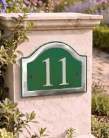A Number 11in Vinyl Green & Chrome Arched House Number Sign Mounted on an Entrance Driveway Wall - Digital Illustration A Number 11in Vinyl Green & Chrome Arched House Number Sign Mounted on an Entrance Driveway Wall - Digital Illustration