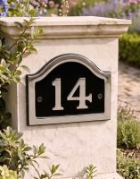 A Number 14 Arched House Number Sign in a Black & Chrome Finish Mounted on a Garden Pillar Driveway - Digital Illustration 