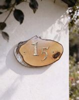 A Number 15 Natural Hard Wood Rustic House Number Sign Mounted on a Sunny Cottage Wall - Digital Illustration A Number 15 Natural Hard Wood Rustic House Number Sign Mounted on a Sunny Cottage Wall - Digital Illustration