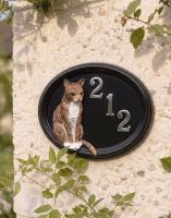 A Number 212 "Marmalade" Hand Painted Thomas Cat House Sign Mounted on a Textured White Cottage Wall - Digital Illustration 
