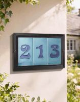 A Number 213 Treble Black Plain Number Tile Frame Mounted on a Sunny Cottage Wall - Digital Illustration 