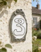 A Number 3 "Winter White" Reflective Cameo House Sign Mounted on a Sunny White Cottage Wall - Digital Illustration 