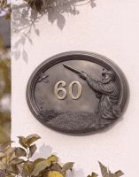 A Number 60 "Game & Grouse" House Number Sign in a Bronze Finish Mounted on a Cream Coloured Cottage Wall - Digital Illustration