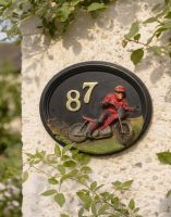 A Number 87 Hand Painted "Macio Motocross" House Sign Mounted on a Sunny Cottage Wall - Digital Illustration 