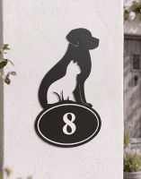 A Number 8 Cat & Dog Iron House Number Sign Mounted on a White Wall Next to a Cottage Entrance - Digital Illustration