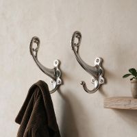 A Pair of "Becksly Park" Loop Hook with Shaped Backplate in Chrome Mounted in an Entrance Hallway - Digital Illustration 