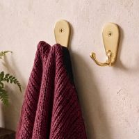 A Pair of "Inglesburg" Double Hook in solid brasss Next to Each other in an Entrance Hallway - Digital Illustration A Pair of "Inglesburg" Double Hook in solid brasss Next to Each other in an Entrance Hallway - Digital Illustration