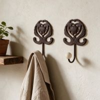 A Pair of "Lady Marguerite" Cast Iron Hooks shown Side by Side - Digital Illustration A Pair of "Lady Marguerite" Cast Iron Hooks shown Side by Side - Digital Illustration