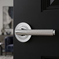 A Polished Chrome Knurled Lever on Plain Rose Set on a Sleek Black Door in a Modern Home Interior - Digital Illustration
