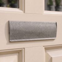 A Traditional 35.5cm Pewter Letter Flap on a Cream Coloured Wooden Front Door - Digital Illustration A Traditional 35.5cm Pewter Letter Flap on a Cream Coloured Wooden Front Door - Digital Illustration
