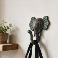 A Verdigris Elephant Hook Shown on a Wall Used to Hold a Bag - Digital Illustration 