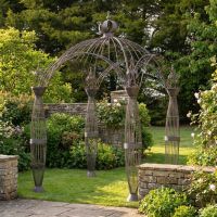 A Victorian Domed Metal Garden Gazebo with Decorative Pillar Columns in an Ornate Garden - Digital Illustration A Victorian Domed Metal Garden Gazebo with Decorative Pillar Columns in an Ornate Garden - Digital Illustration