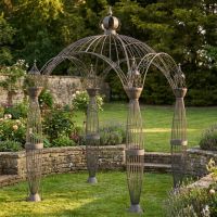 A Victorian Domed Metal Garden Gazebo with Decorative Pillar Columns Positioned on a Sunny Garden Lawn - Digital Illustration A Victorian Domed Metal Garden Gazebo with Decorative Pillar Columns Positioned on a Sunny Garden Lawn - Digital Illustration