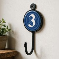 A Vivid Blue & White No.3 Iron Hook on a Cream Coloured Wall Next to a DIY Timber Shelf - Digital Illustration A Vivid Blue & White No.3 Iron Hook on a Cream Coloured Wall Next to a DIY Timber Shelf - Digital Illustration