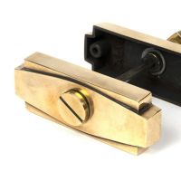 Close-Up of Connected Aged Brass Art Deco Bathroom Thumb Lock