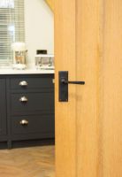 Aged Bronze Lever Lock Door Handle on Door