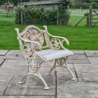 Aged Cream Cast Iron Dog One Seat Park Bench in Situ on the Patio
