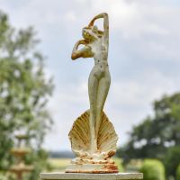 Lady Standing on Clam Sculpture in Situ