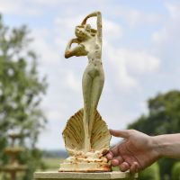 Lady Standing on Clam Sculpture to Scale