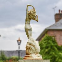 View of the Back of the Lady Standing on Clam Sculpture