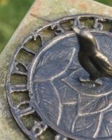 Close-up of the Aged Bronze Finish on the "Tweeting Time" Bird Sundial