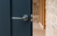 Aged Pewter Unsprung Lever Door Handle on Art Deco Rose in Situ Aged Pewter Unsprung Lever Door Handle on Art Deco Rose in Situ