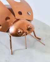 Close up of intricate face detail on scrap metal sculpture