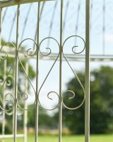 Close up of intricate scrollwork on ornate iron gazebo